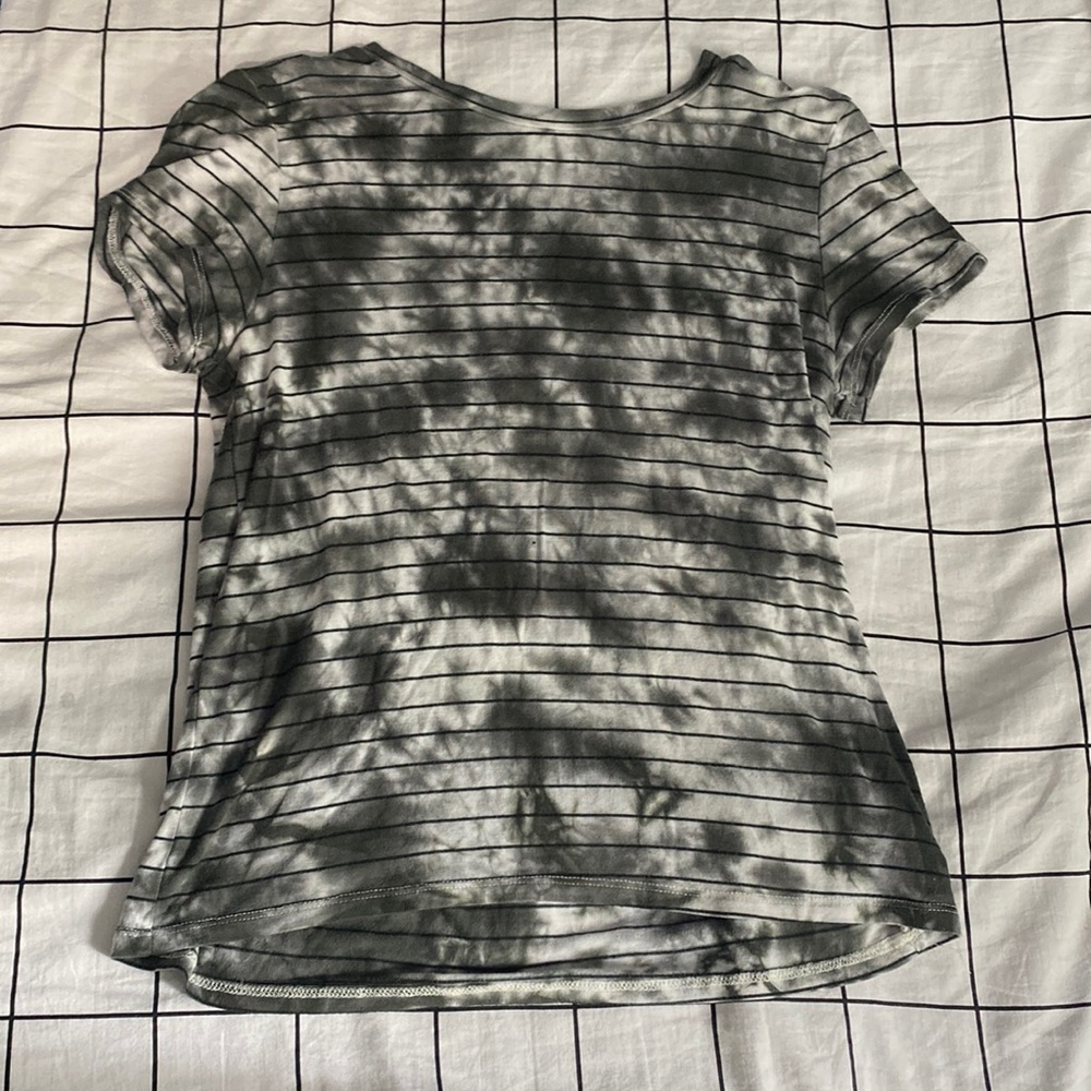Green and white t-shirt.